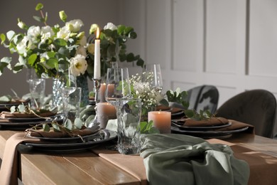 Festive table setting with beautiful floral decor indoors