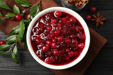 Photo of Flat lay composition with cranberry sauce on grey wooden table