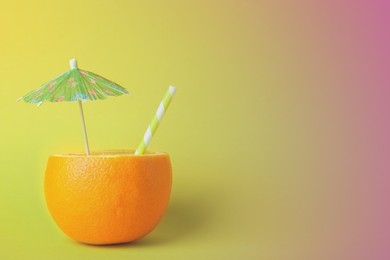 Image of Orange with straw and small paper umbrella on color background, space for text. Summer party