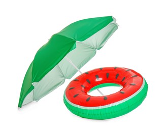 Photo of Open green beach umbrella with inflatable ring on white background