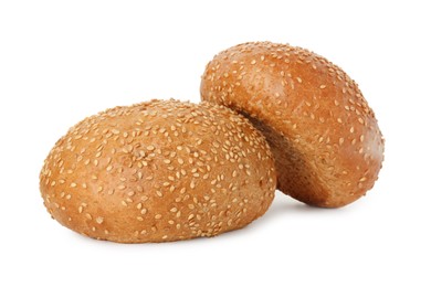 Photo of Two fresh hamburger buns with sesame seeds isolated on white