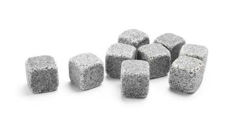 Photo of Classic grey whiskey stones on white background