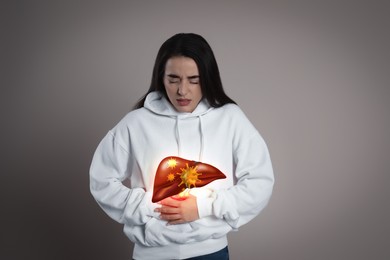 Image of Sick woman suffering from pain and illustration of unhealthy liver on light blue background. Viral hepatitis