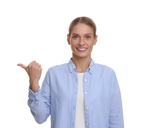 Photo of Special promotion. Smiling woman pointing at something on white background