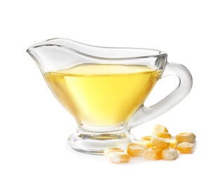 Photo of Gravy boat with fresh corn oil and kernels on white background