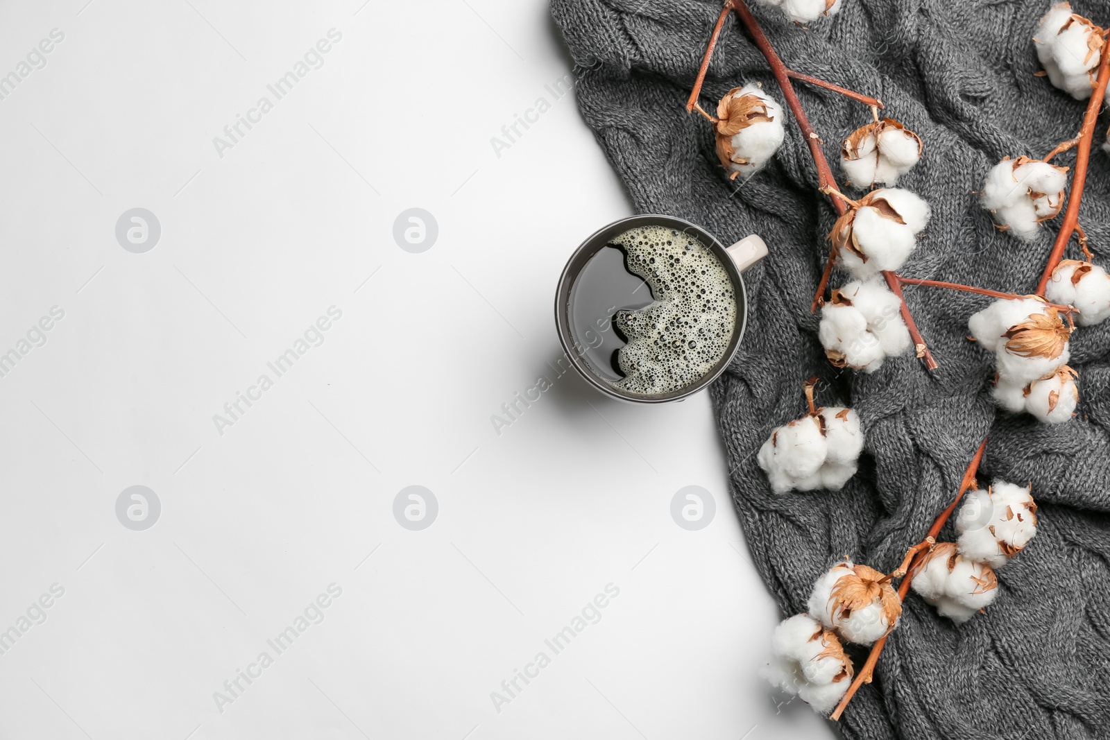 Flat lay composition with hot drink and warm plaid on white background, space for text Photo of Flat lay composition with hot drink and warm plaid on white background, space for text