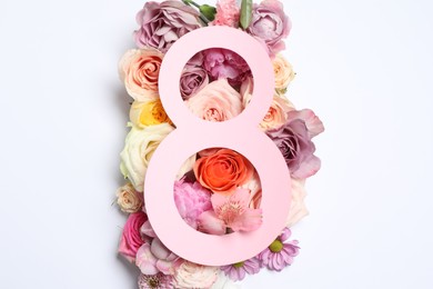 Photo of 8 March greeting card design with flowers on white background, top view. Happy International Women's Day
