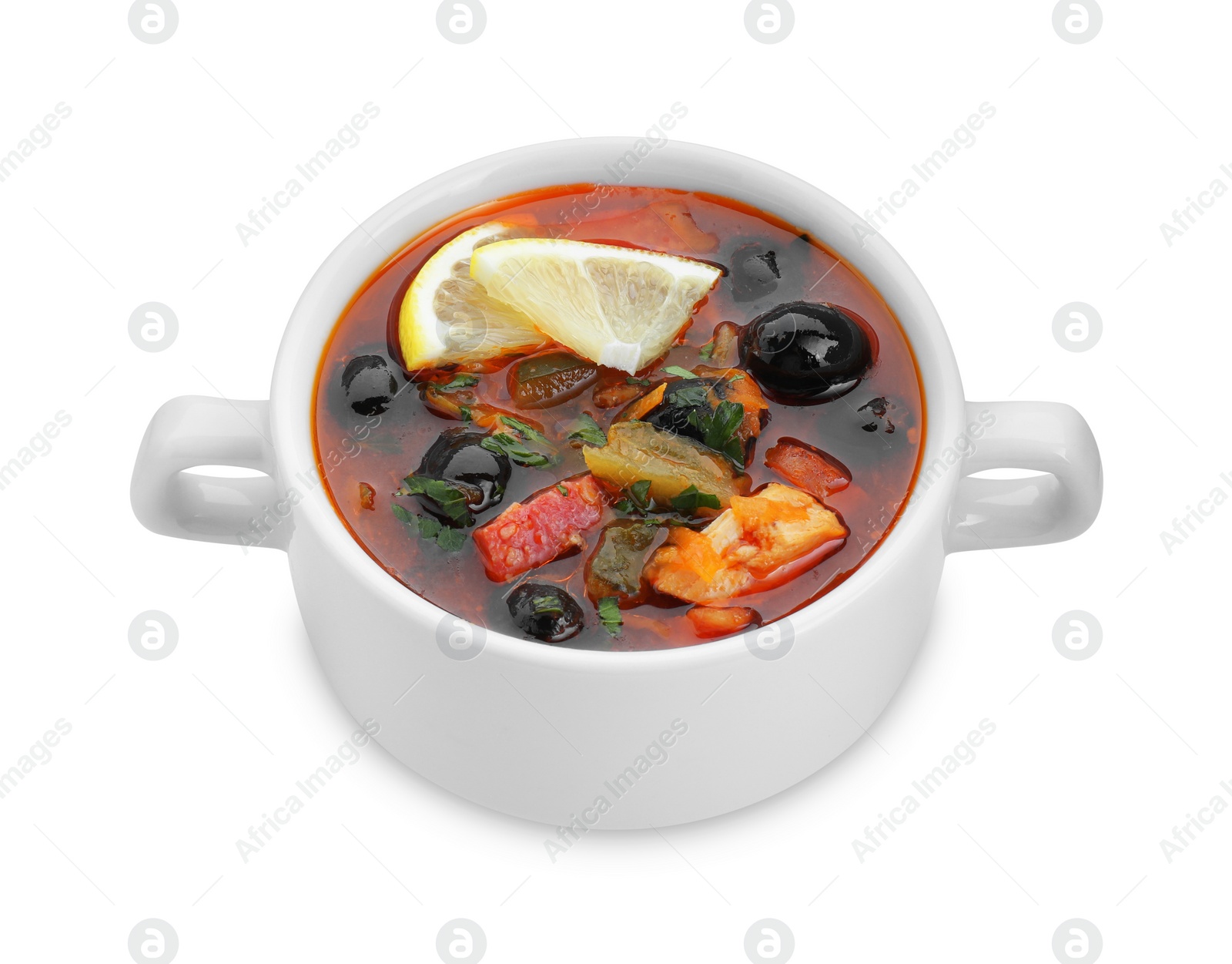 Photo of Meat solyanka soup with sausages, olives and vegetables in bowl isolated on white