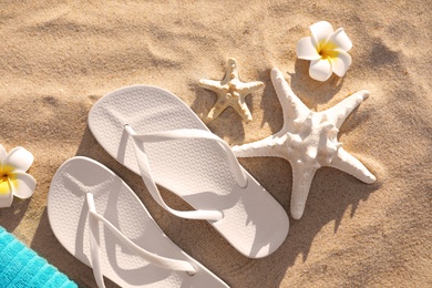 Photo of Flat lay composition with beach accessories on sand