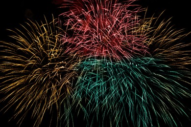 Image of Beautiful bright fireworks lighting up night sky