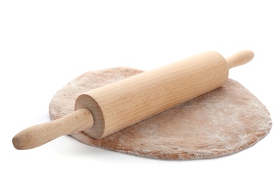 Photo of Raw rye dough and rolling pin on white background