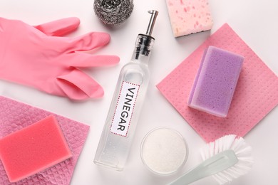 Photo of Eco friendly natural cleaners. Flat lay composition with bottle of vinegar on white background