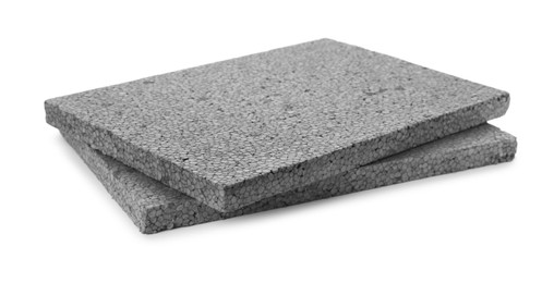 Photo of Two grey styrofoam sheets on white background