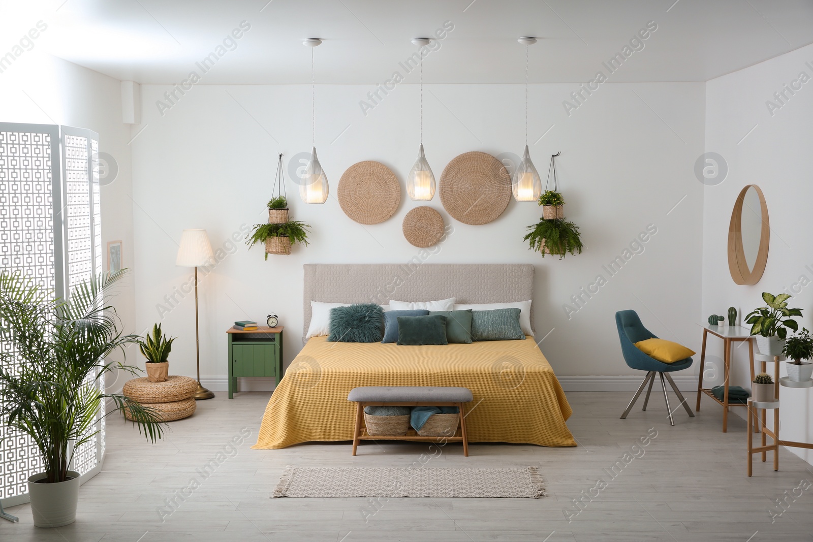 Stylish room interior with large comfortable bed Photo of Stylish room interior with large comfortable bed