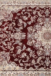 Photo of Soft carpet with beautiful pattern as background, top view