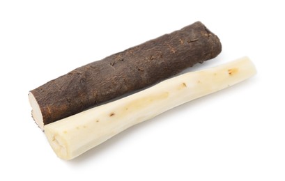 Photo of Cut raw salsify roots isolated on white
