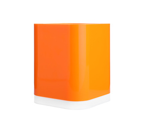 Photo of Orange plastic holder isolated on white. Stationery for school