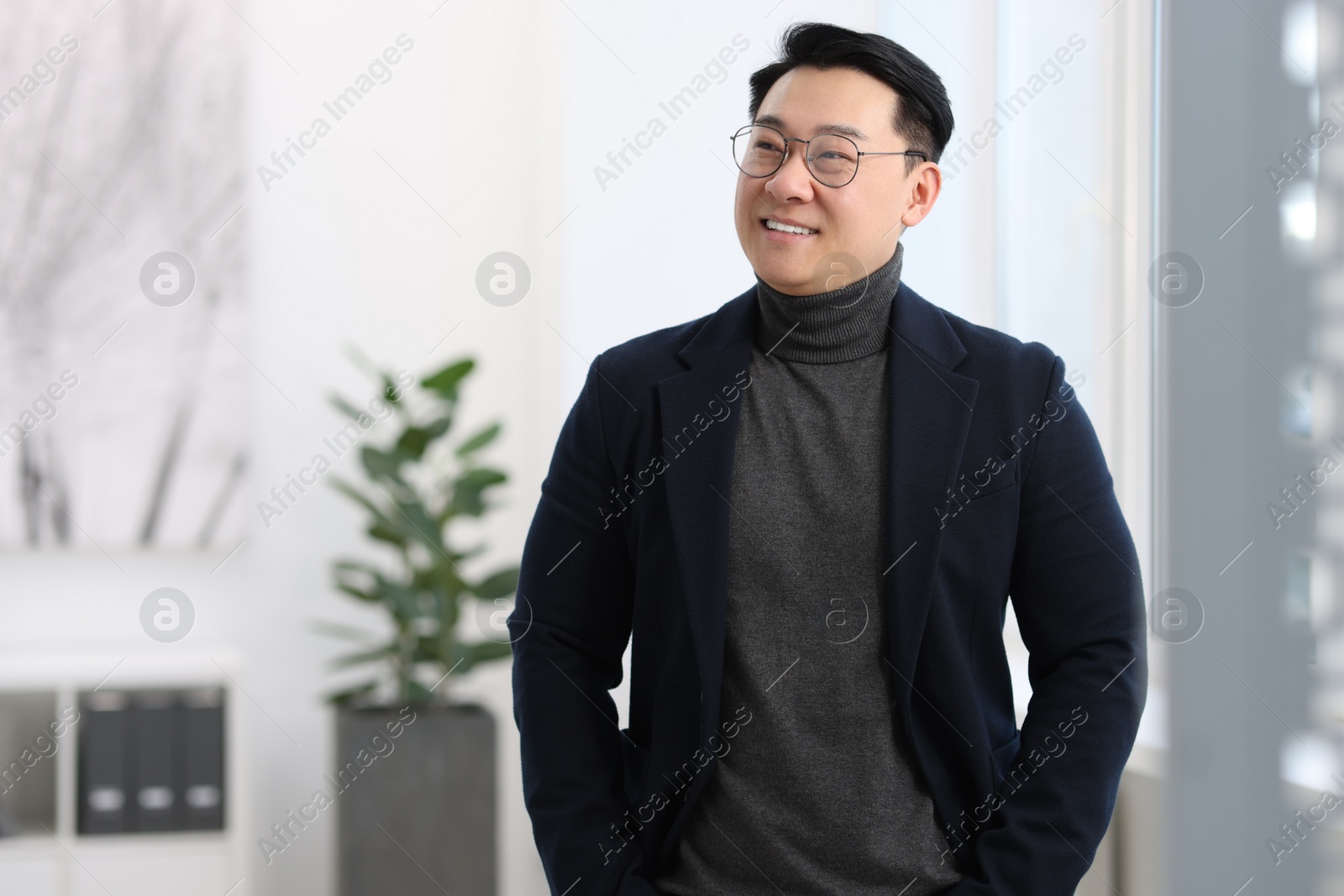 Photo of Portrait of smiling businessman in office. Space for text