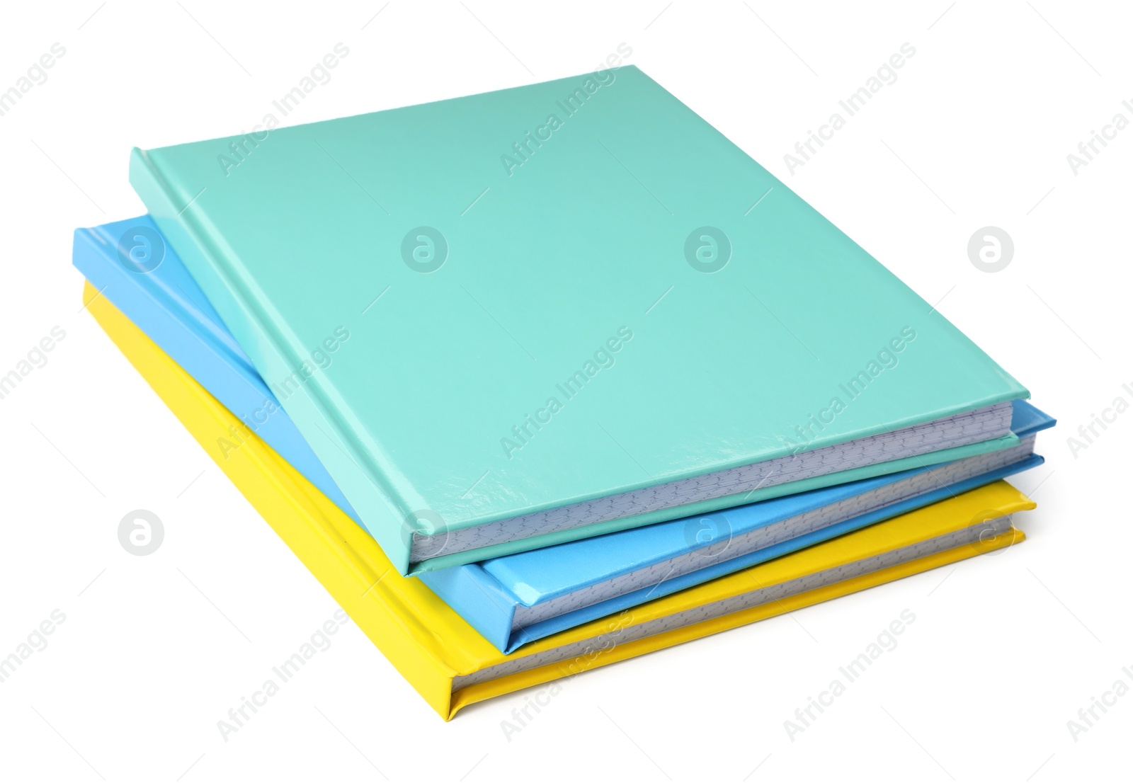 Photo of Stack of different colorful hardcover planners on white background