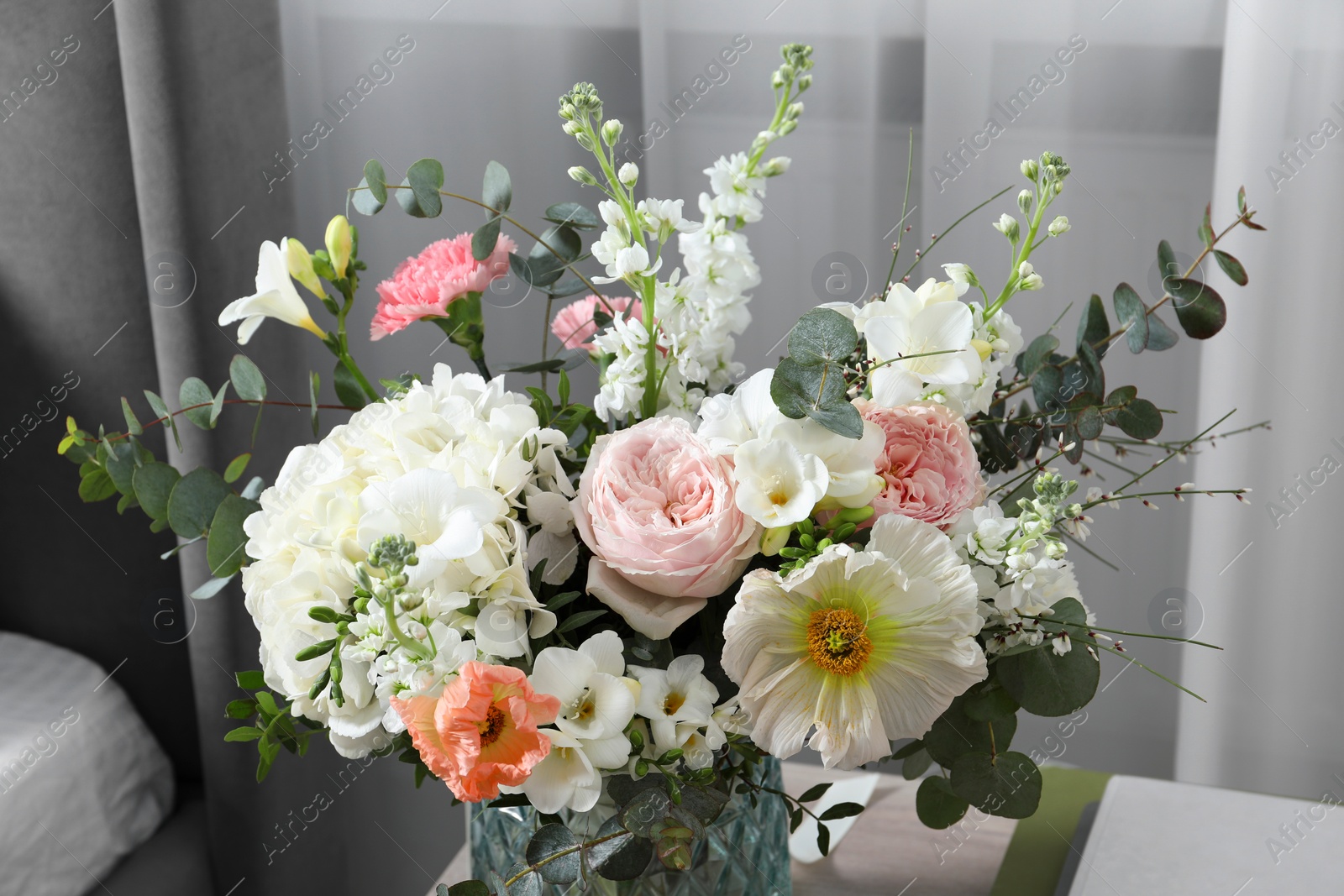 Photo of Beautiful bouquet of different fresh flowers indoors, closeup