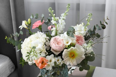 Photo of Beautiful bouquet of different fresh flowers indoors, closeup