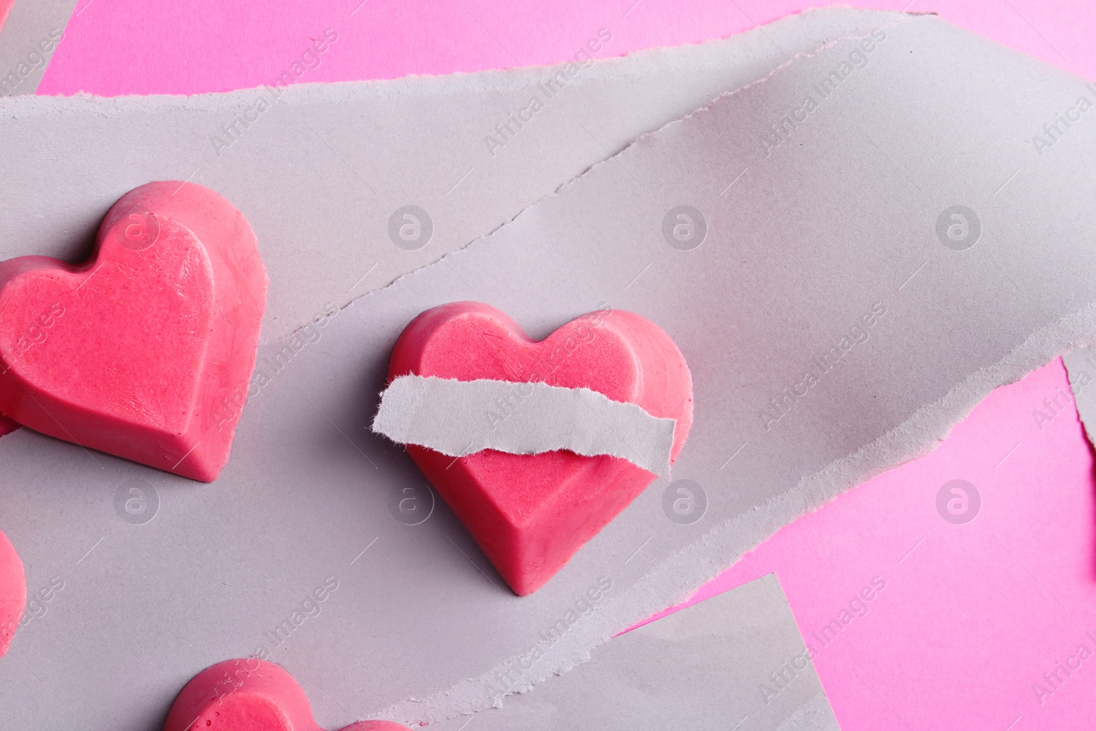 Photo of Composition with heart shaped berry ice cubes on color background, flat lay