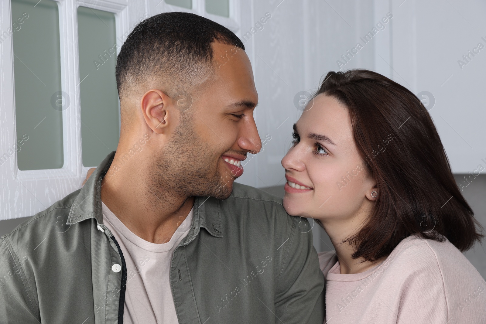 Photo of Dating agency. Happy couple enjoying time together at home