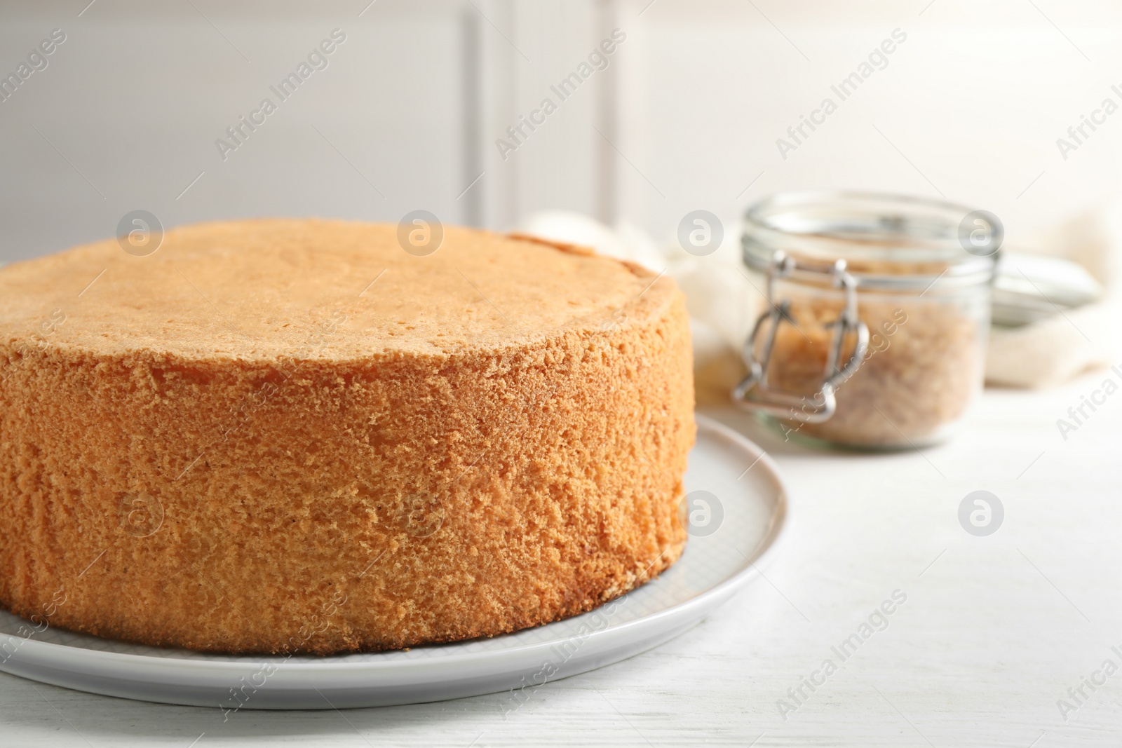 Photo of Delicious fresh homemade cake on white wooden table