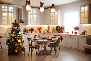 Image of Stylish kitchen interior with beautiful Christmas decor