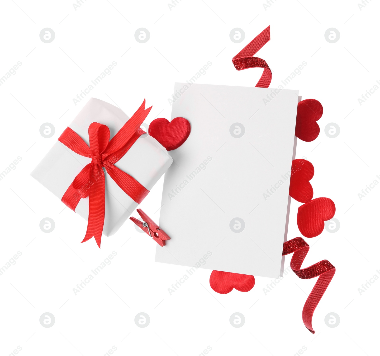 Photo of Blank card, gift box and red decorative hearts on white background, top view. Valentine's Day celebration