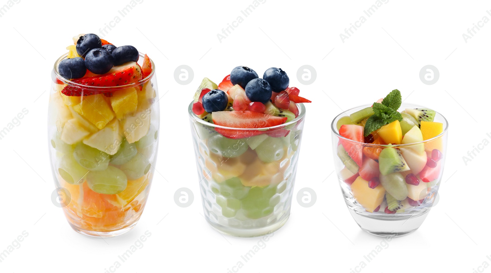 Image of Delicious fruit salads in glasses isolated on white, set