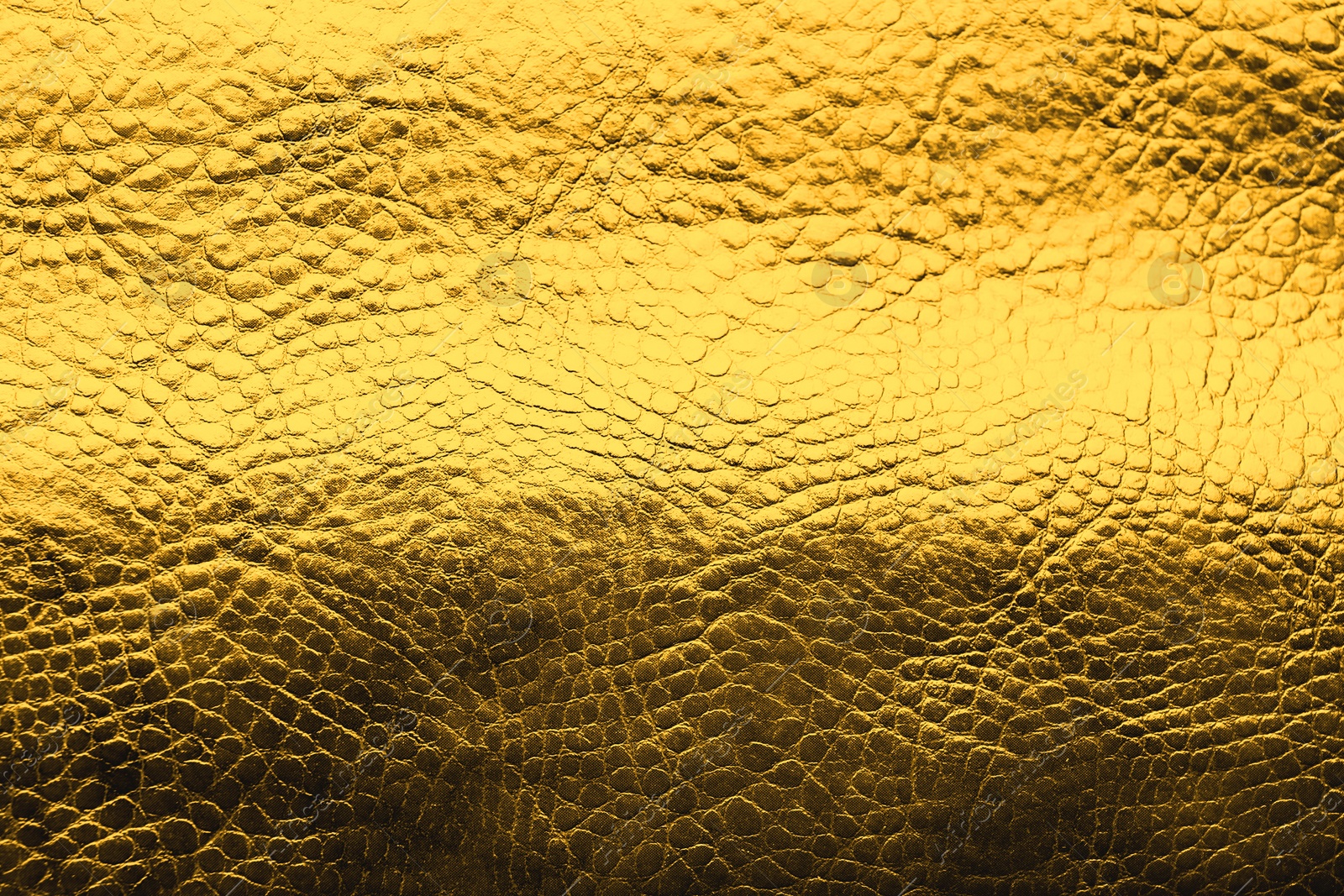 Image of Golden textured surface as background, closeup view