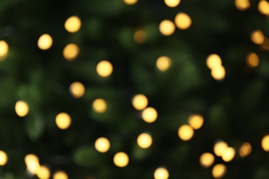 Photo of Abstract background with blurred yellow Christmas lights, bokeh effect