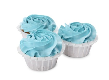 Photo of Baby shower cupcakes with light blue cream on white background