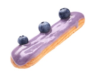 Delicious eclair decorated with blueberries isolated on white