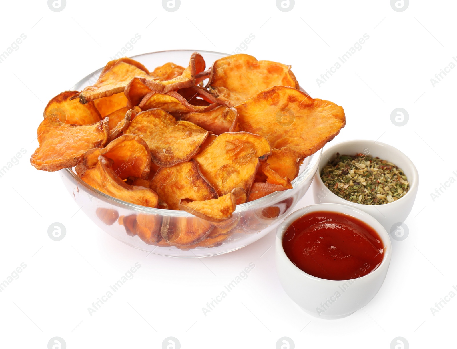 Photo of Bowl of sweet potato chips with sauce and herbs isolated on white