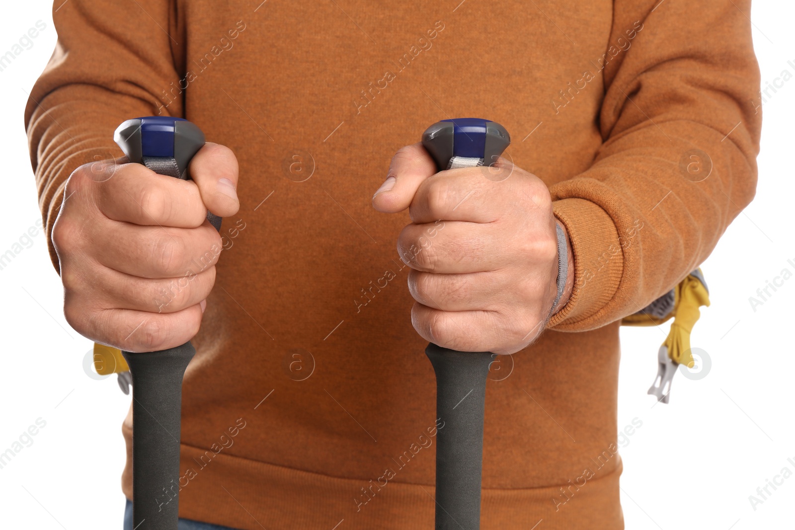 Photo of Male hiker with backpack and trekking poles on white background, closeup