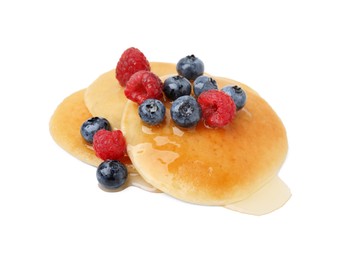 Tasty pancakes with berries and honey isolated on white