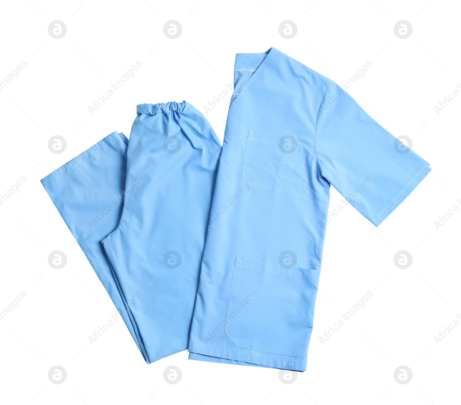 Photo of Medical uniform on white background, top view. Professional work clothes