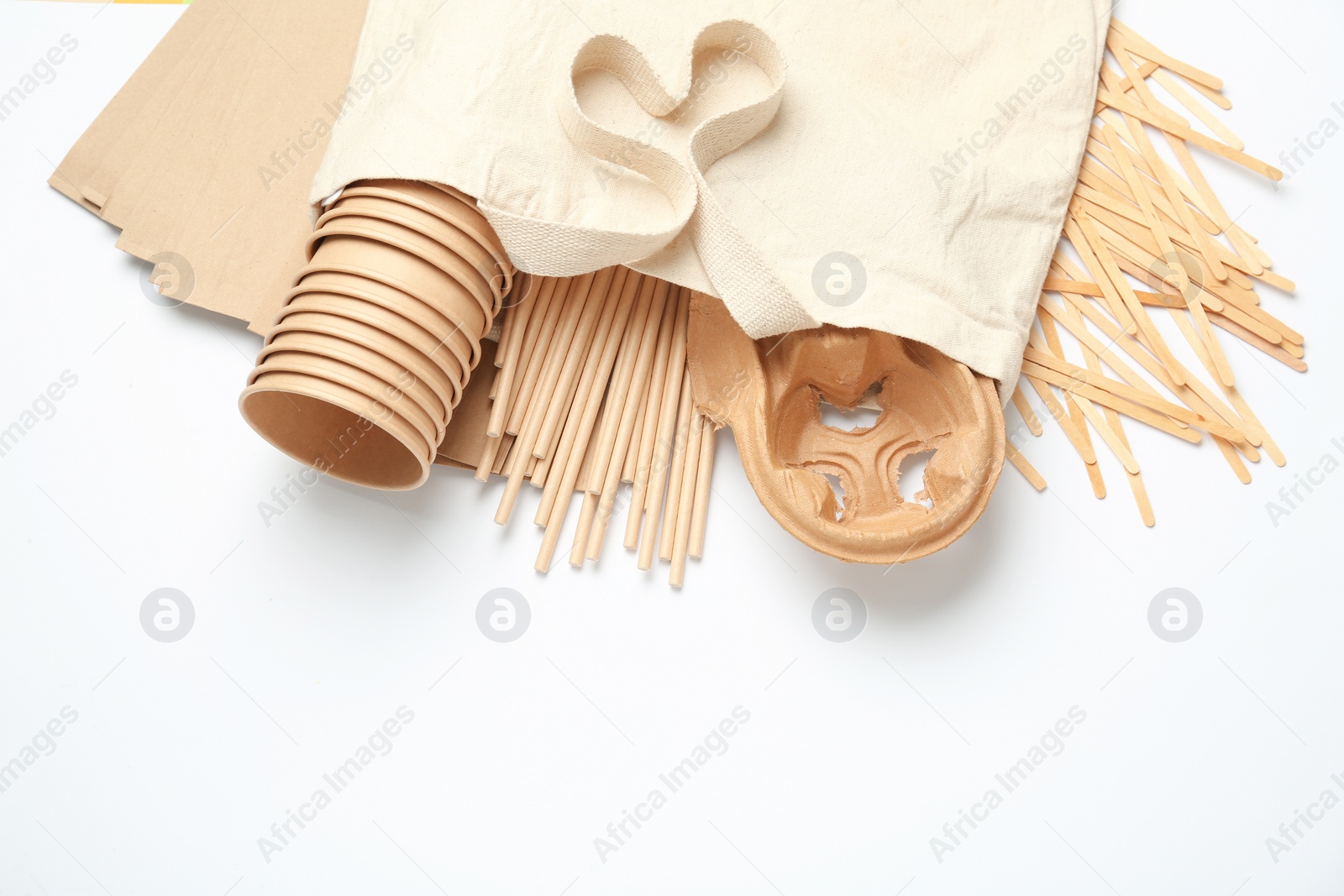 Photo of Eco friendly products on white background, flat lay