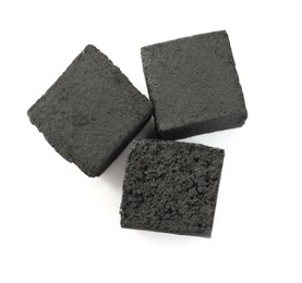 Photo of Charcoal cubes for hookah on white background, top view