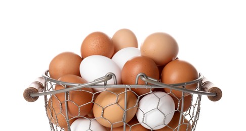 Photo of Fresh chicken eggs in metal basket isolated on white