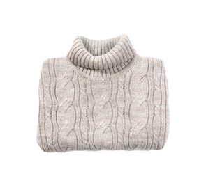 Folded cozy warm sweater on white background, top view