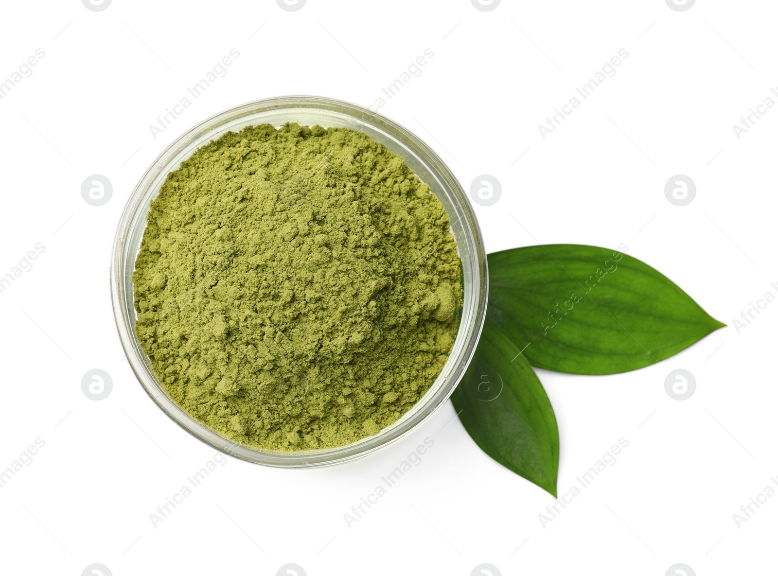 Photo of Henna powder in bowl and green leaves isolated on white, top view