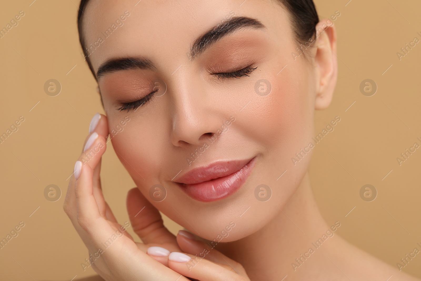 Photo of Beautiful woman with healthy skin on beige background, closeup