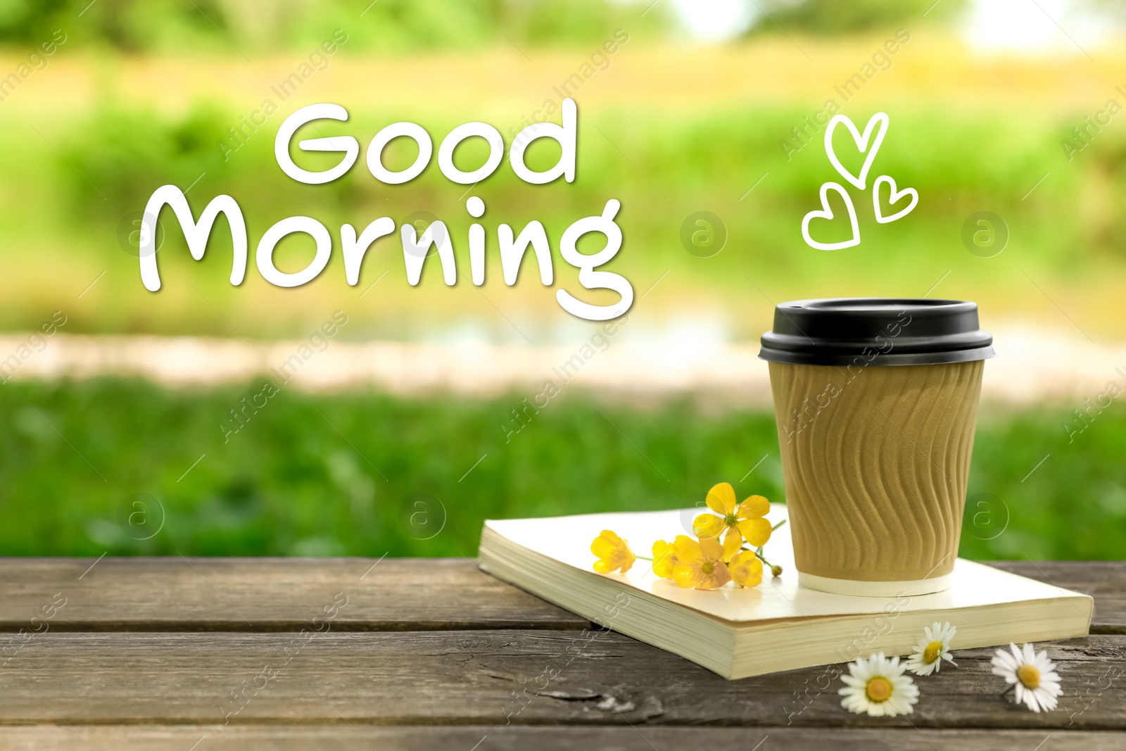 Image of Good morning! Paper coffee cup, flowers and book on wooden table outdoors