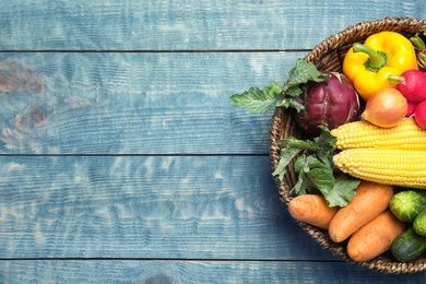 Photo of Flat lay composition with fresh vegetables and space for text on wooden background