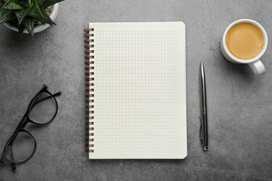 Flat lay composition with notebook on grey table