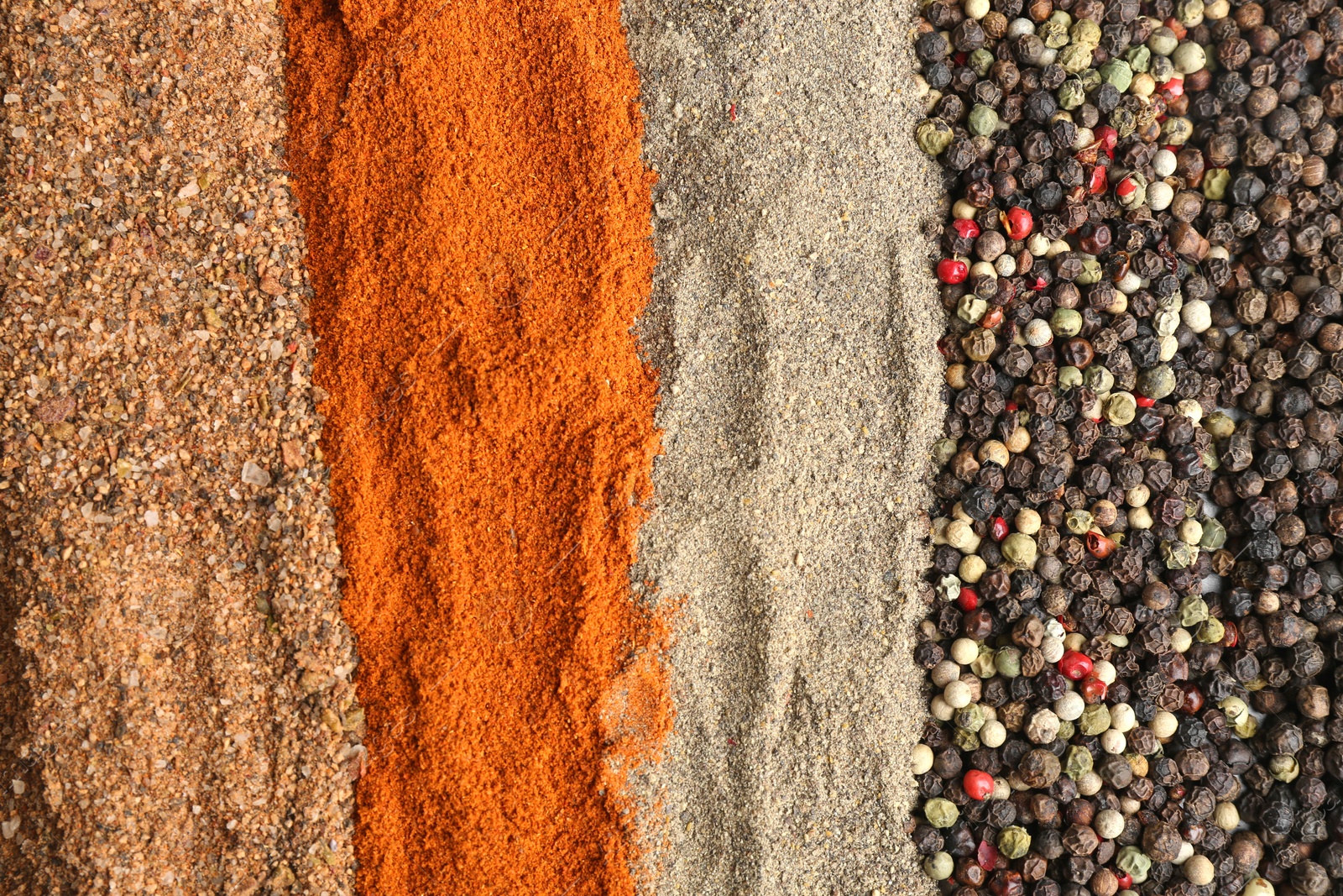 Photo of Different ground peppers and corns as background, closeup