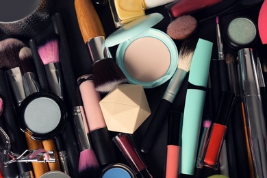 Photo of Set of different makeup products and tools as background, top view